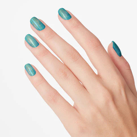 Hand with teal nail polish on a light gray background