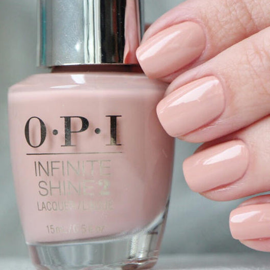 OPI Infinite Shine nail polish bottle with a hand showing nails painted with the same color.