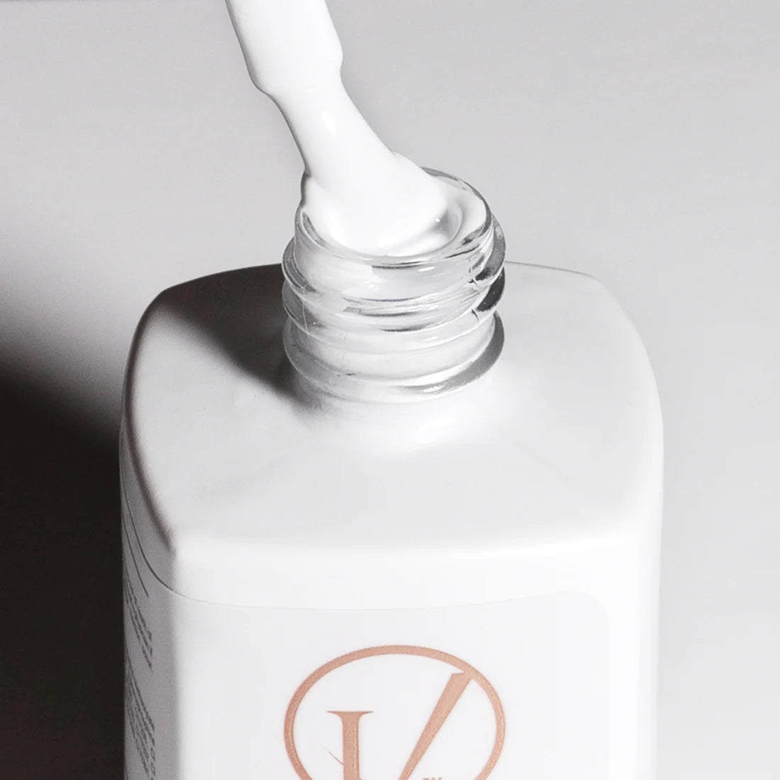 opened white gel nail polish bottle